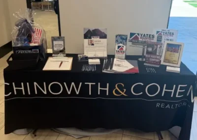 Yates Roofing promotional material table at Chinowth and Cohen Sales Meeting, May 2025