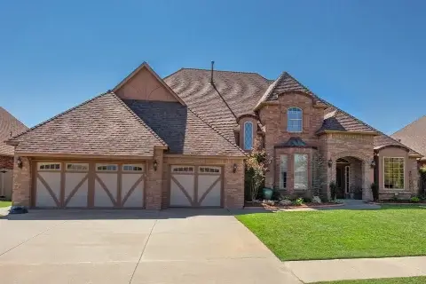 Residential home with impact resistant shingles installed by Yates Roofing & Construction in OKC